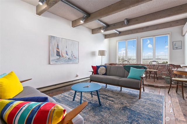 living room with beam ceiling, a baseboard radiator, a textured ceiling, and hardwood / wood-style flooring