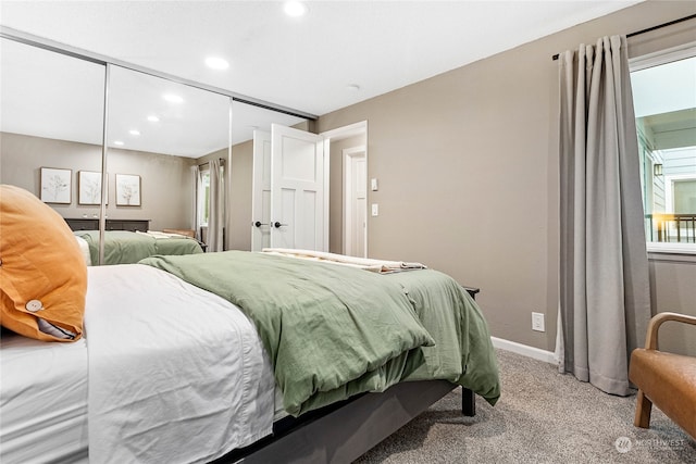 carpeted bedroom featuring a closet