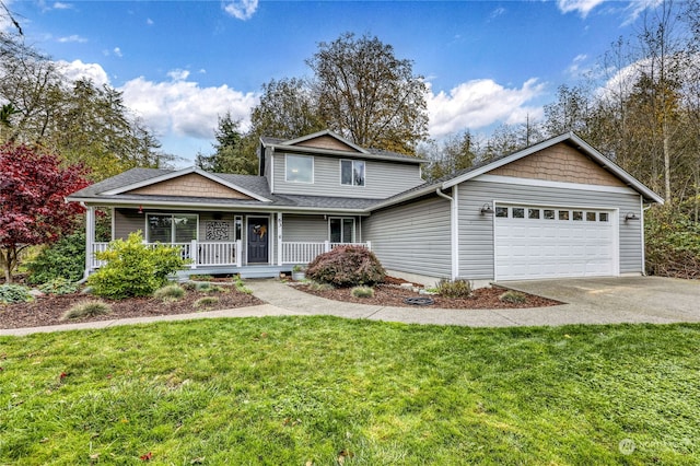 front facade featuring a porch, a front lawn, and a garage