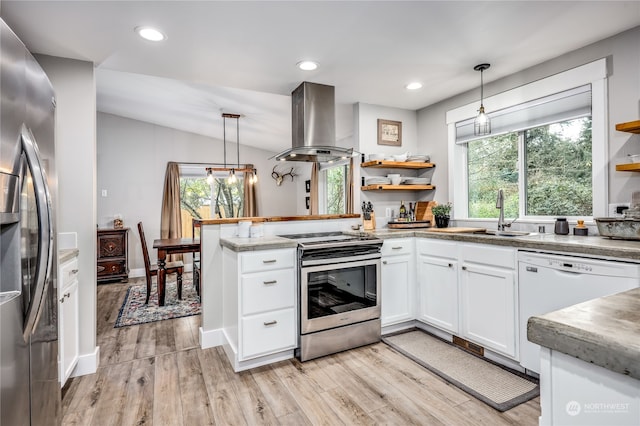 kitchen featuring pendant lighting, island exhaust hood, appliances with stainless steel finishes, and sink