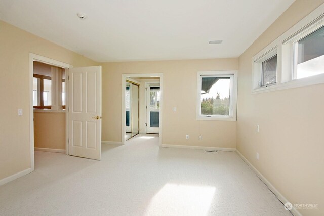 4962 Lilac Dr, Freeland, WA 98249 - empty room with light colored carpet and baseboards