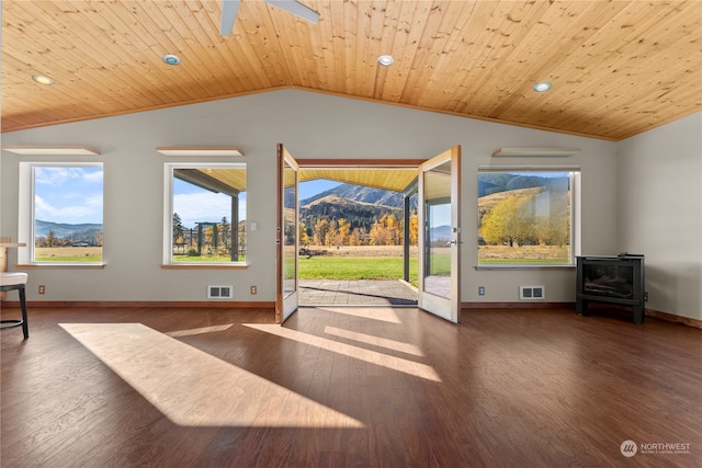 unfurnished living room with lofted ceiling, a mountain view, wooden ceiling, and dark wood-type flooring