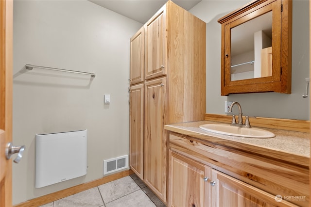 bathroom with vanity and tile patterned flooring