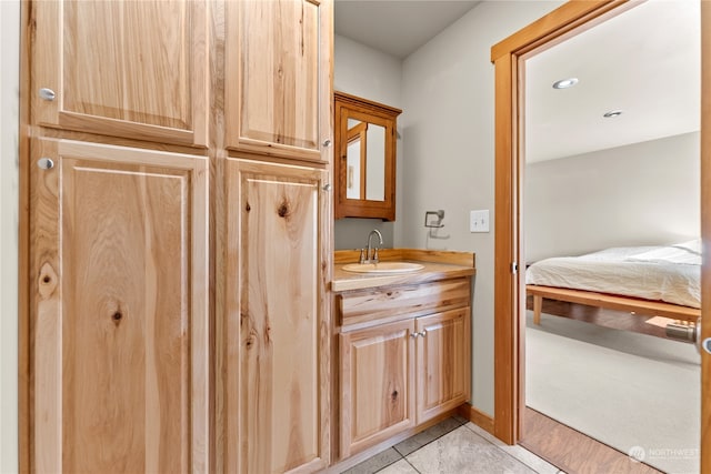 bathroom with vanity and tile patterned flooring