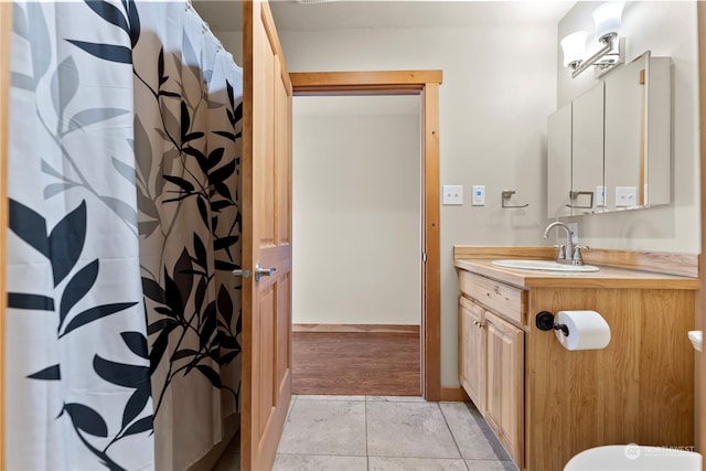 bathroom with vanity and tile patterned flooring