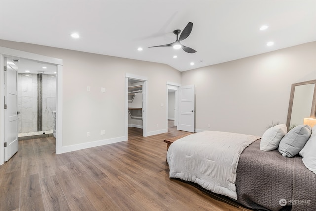 bedroom featuring ensuite bathroom, ceiling fan, hardwood / wood-style floors, a walk in closet, and a closet