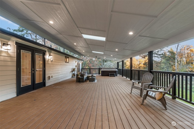 deck featuring a hot tub