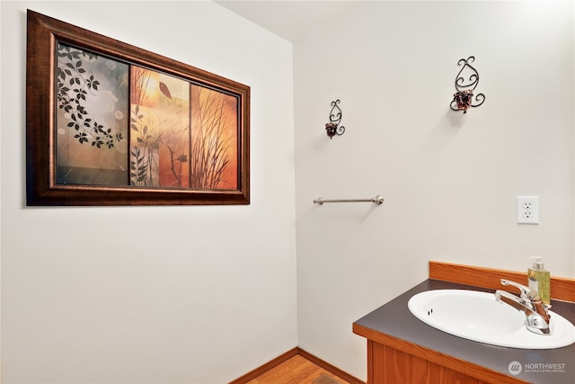 bathroom with vanity and wood-type flooring