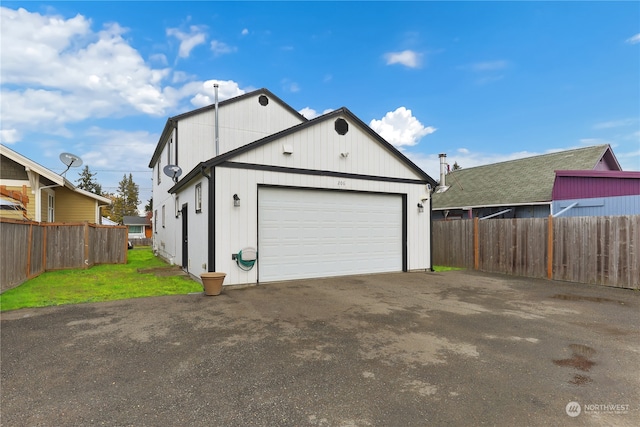 garage featuring a yard