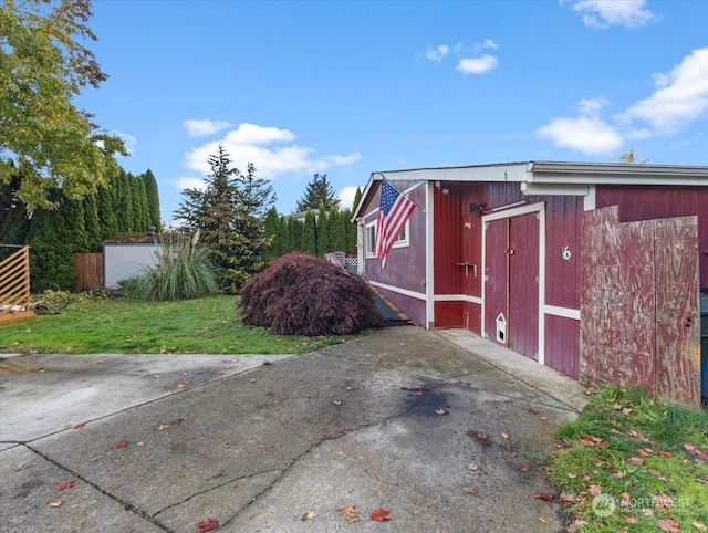 view of outdoor structure with a yard