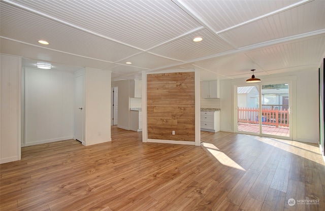 unfurnished living room featuring light wood-type flooring