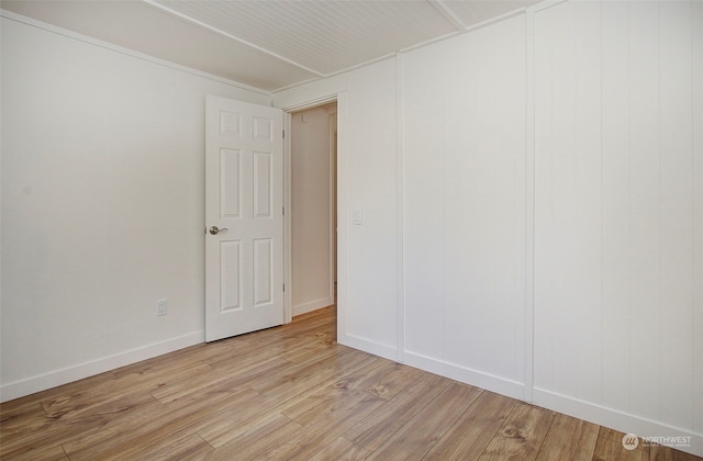 spare room with light wood-type flooring