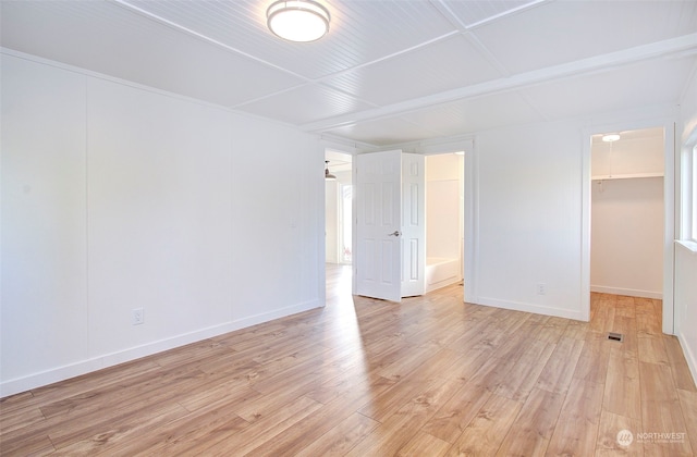 unfurnished room featuring light hardwood / wood-style floors