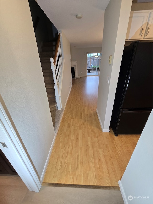 corridor featuring light hardwood / wood-style floors