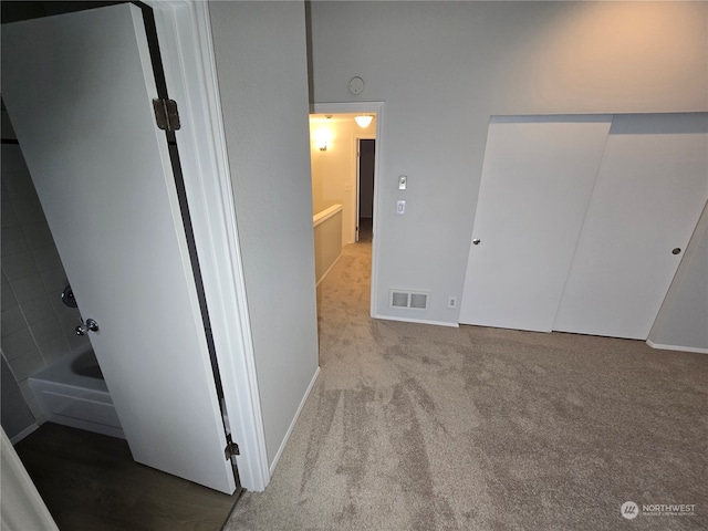 unfurnished bedroom featuring light colored carpet