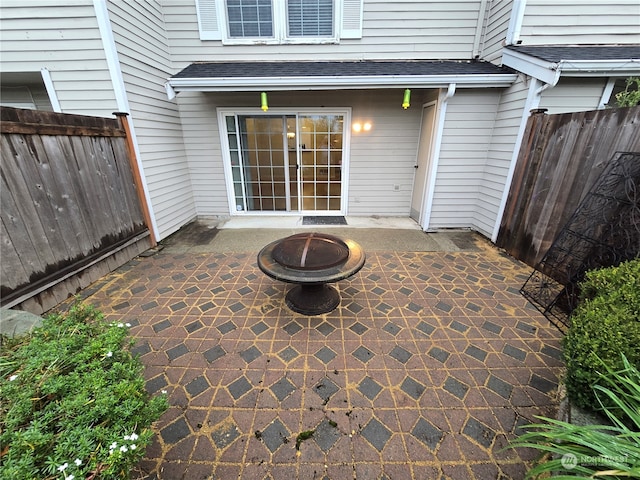 view of patio / terrace featuring an outdoor fire pit