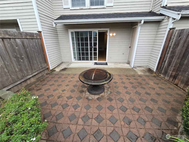 view of patio with an outdoor fire pit