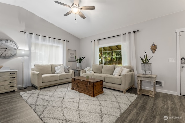 living room with vaulted ceiling, hardwood / wood-style flooring, and ceiling fan