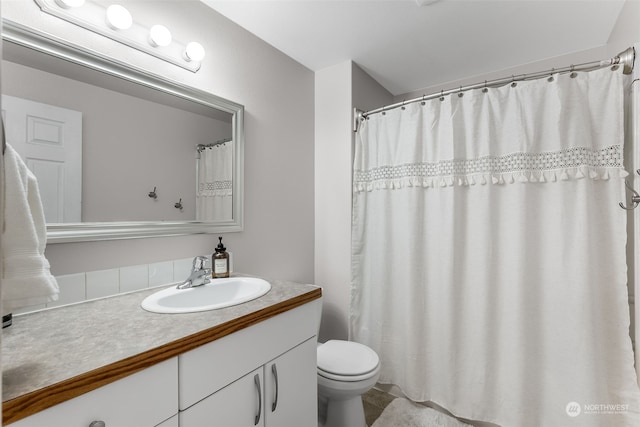 bathroom featuring vanity, toilet, and tile patterned floors