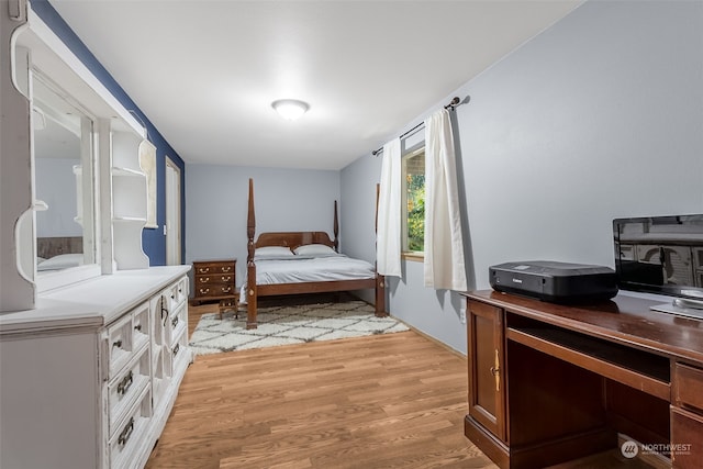 bedroom with light hardwood / wood-style floors