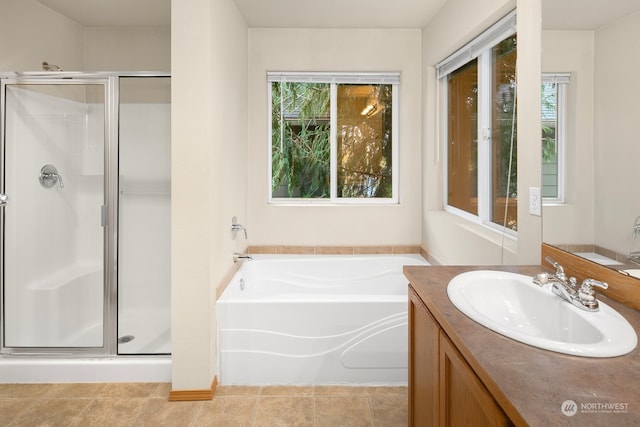 bathroom featuring vanity, tile patterned floors, and separate shower and tub