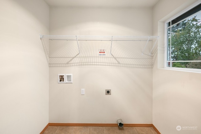 laundry area featuring hookup for an electric dryer, washer hookup, and tile patterned flooring