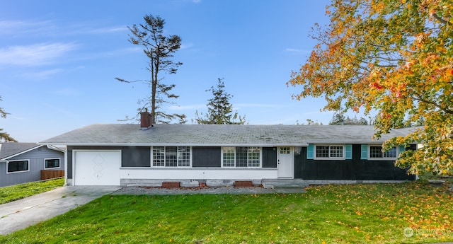 single story home featuring a front yard and a garage