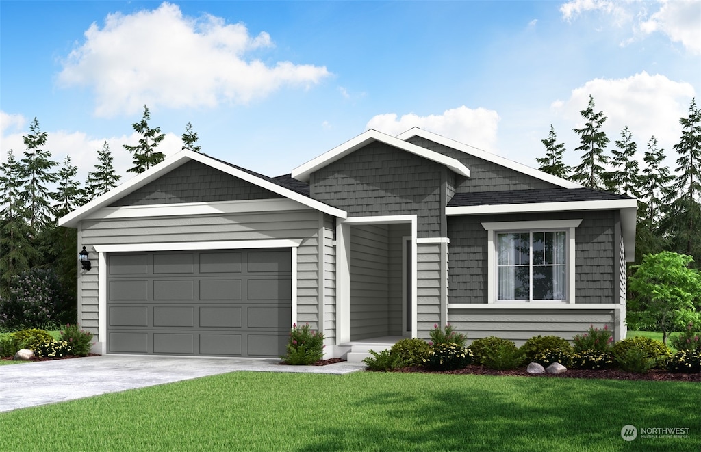 view of front of property with a garage and a front lawn