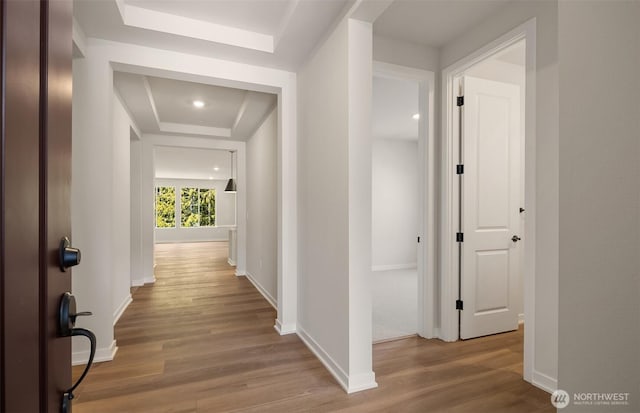23557 Arbors Terrace Rd NE Unit 32, Kingston, WA 98346 - hall with a raised ceiling, wood finished floors, and baseboards