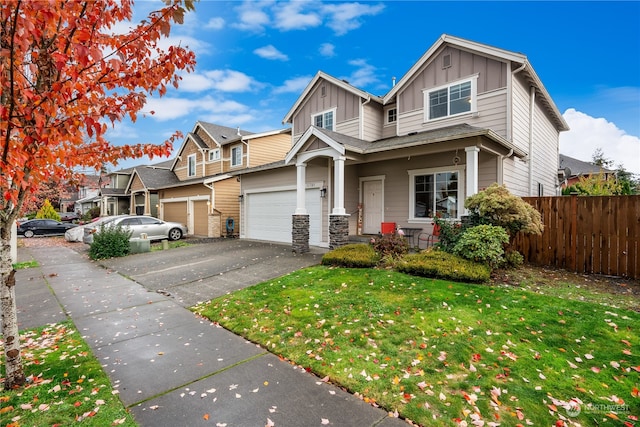 view of front of home featuring a garage and a front lawn