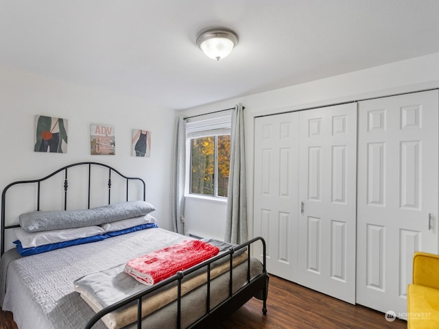 bedroom featuring a closet and dark hardwood / wood-style flooring