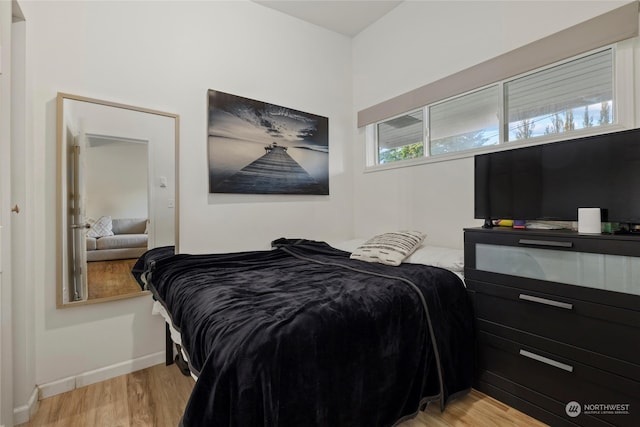 bedroom with light hardwood / wood-style flooring