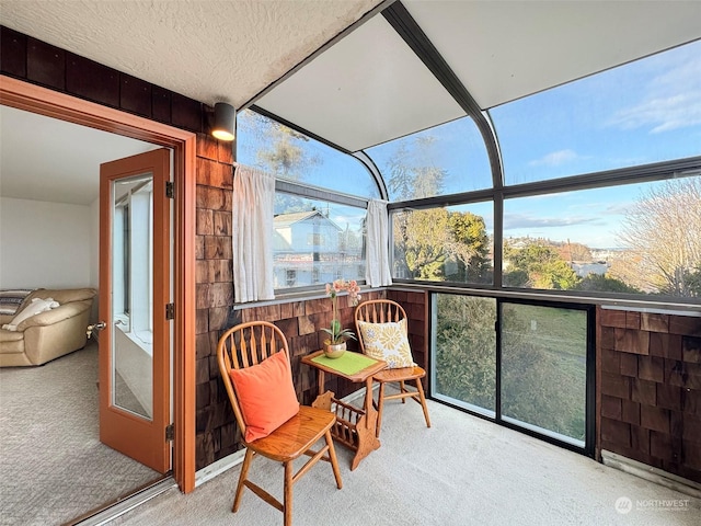 226 W 2nd St Unit 4, Port Angeles, WA 98362 - sunroom featuring carpet, wood walls, and a textured ceiling