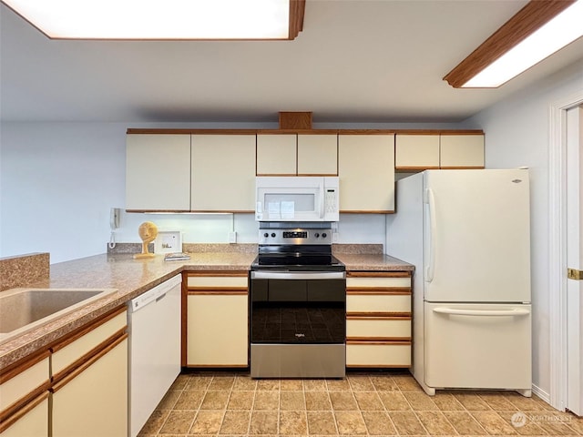 kitchen with sink and white appliances