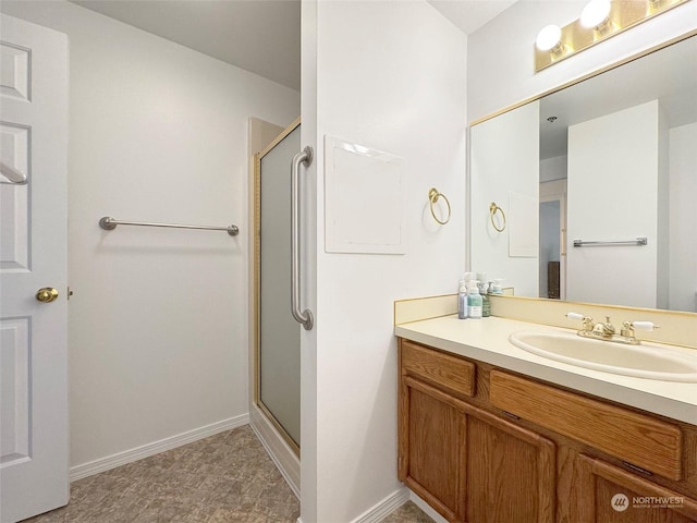 bathroom with vanity and an enclosed shower