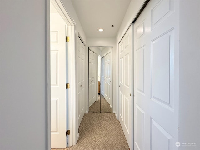 corridor with light carpet