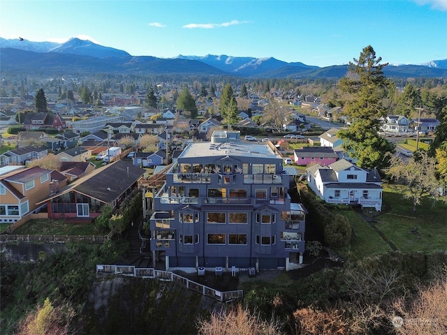 birds eye view of property featuring a mountain view