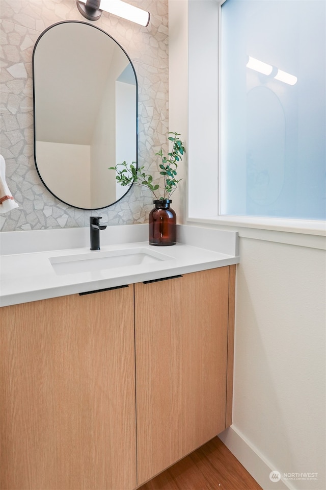 bathroom featuring vanity and wood-type flooring