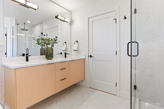 bathroom with a shower with door and vanity