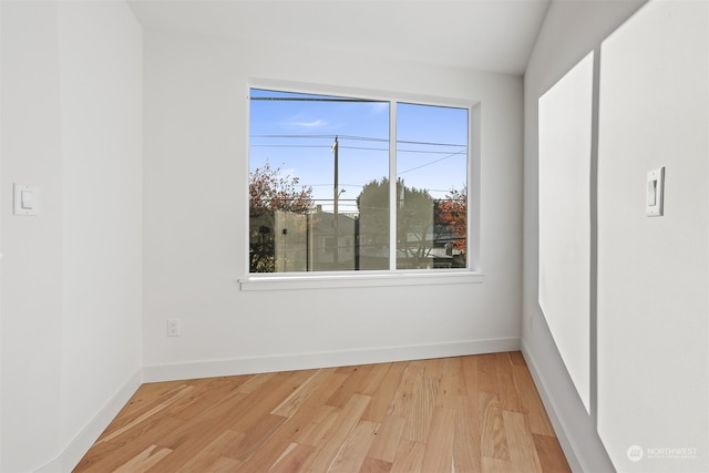 spare room featuring light hardwood / wood-style flooring