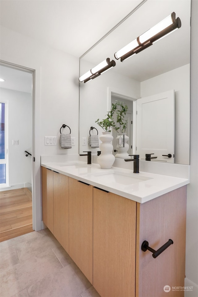 bathroom with vanity and hardwood / wood-style flooring