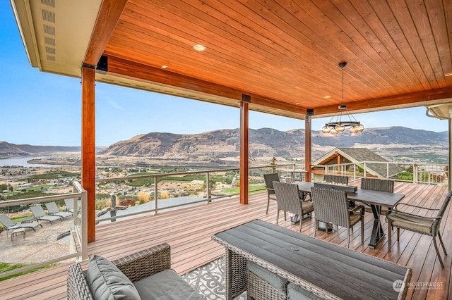 1114 S Wells, East Wenatchee, WA 98802 - wooden terrace with outdoor dining area and a mountain view