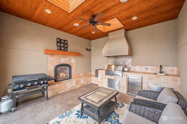 1114 S Wells, East Wenatchee, WA 98802 - view of patio / terrace featuring a tiled fireplace, a sink, and a ceiling fan