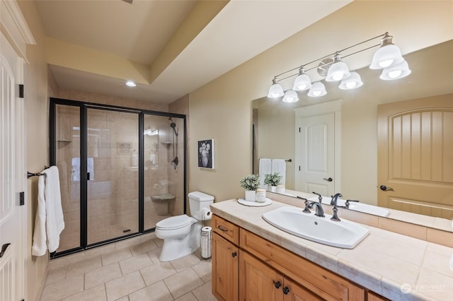 1114 S Wells, East Wenatchee, WA 98802 - bathroom featuring toilet, vanity, a shower stall, and tile patterned floors