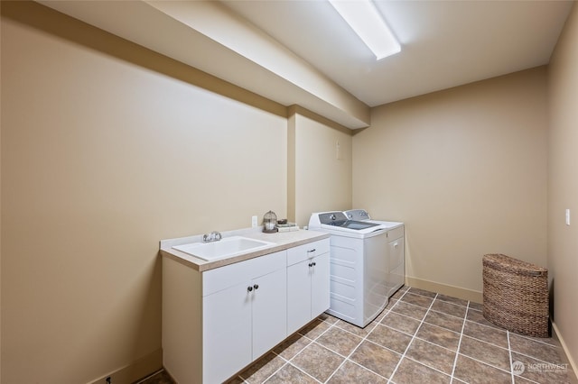 1114 S Wells, East Wenatchee, WA 98802 - washroom with washing machine and dryer, cabinet space, baseboards, and light tile patterned flooring