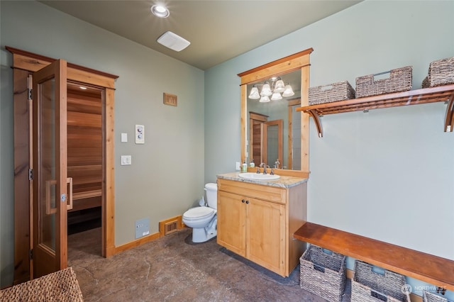 1114 S Wells, East Wenatchee, WA 98802 - bathroom with vanity, toilet, baseboards, and recessed lighting