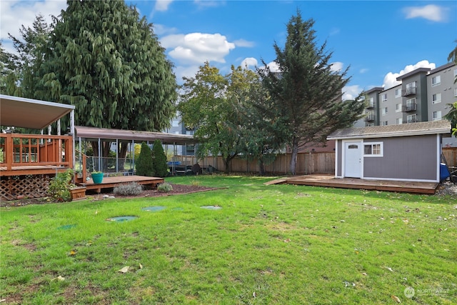 view of yard with an outbuilding and a deck