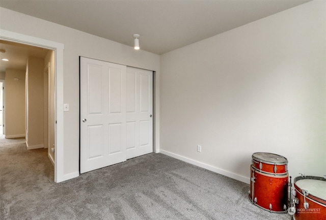 unfurnished bedroom featuring a closet and carpet floors