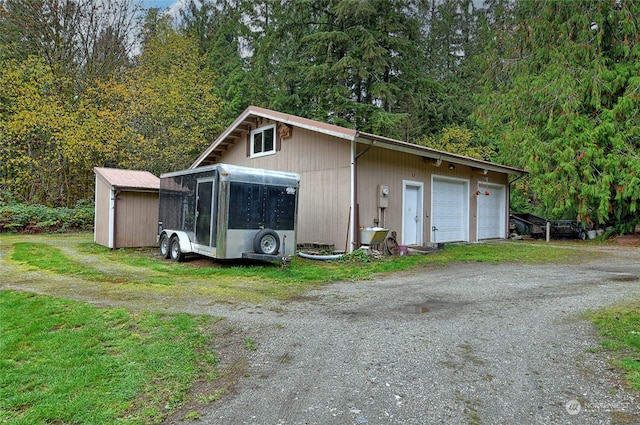 view of outbuilding featuring a garage