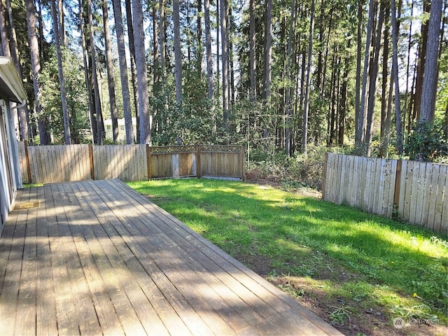 wooden deck with a yard